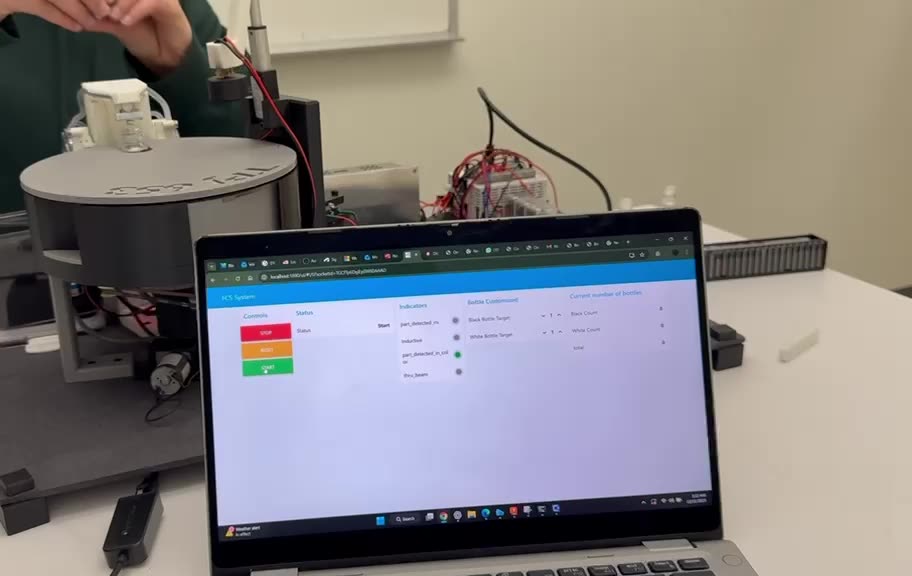 Node-RED dashboard on laptop next to capstone rig